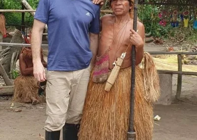 Traveler with an indigenous person in the Amazon