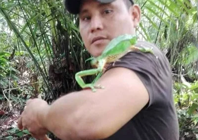 Posing with a green frog in the Amazon - Amazon Lodge and Expeditions
