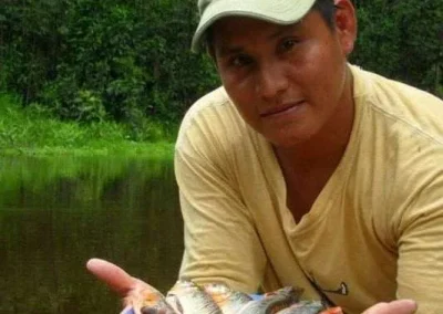 Showing caught fish in the Amazon