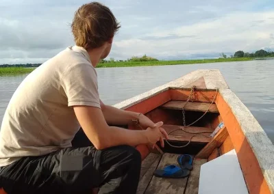 Traveler observing the river from the boat